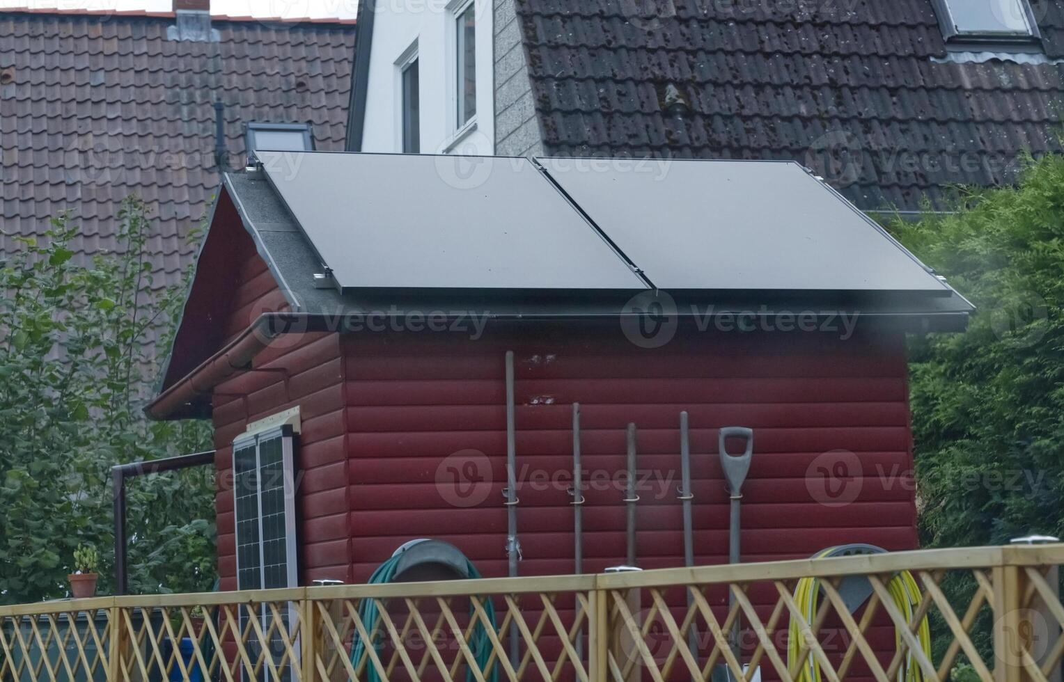 Red Wooden Shed with Solar Panels photo