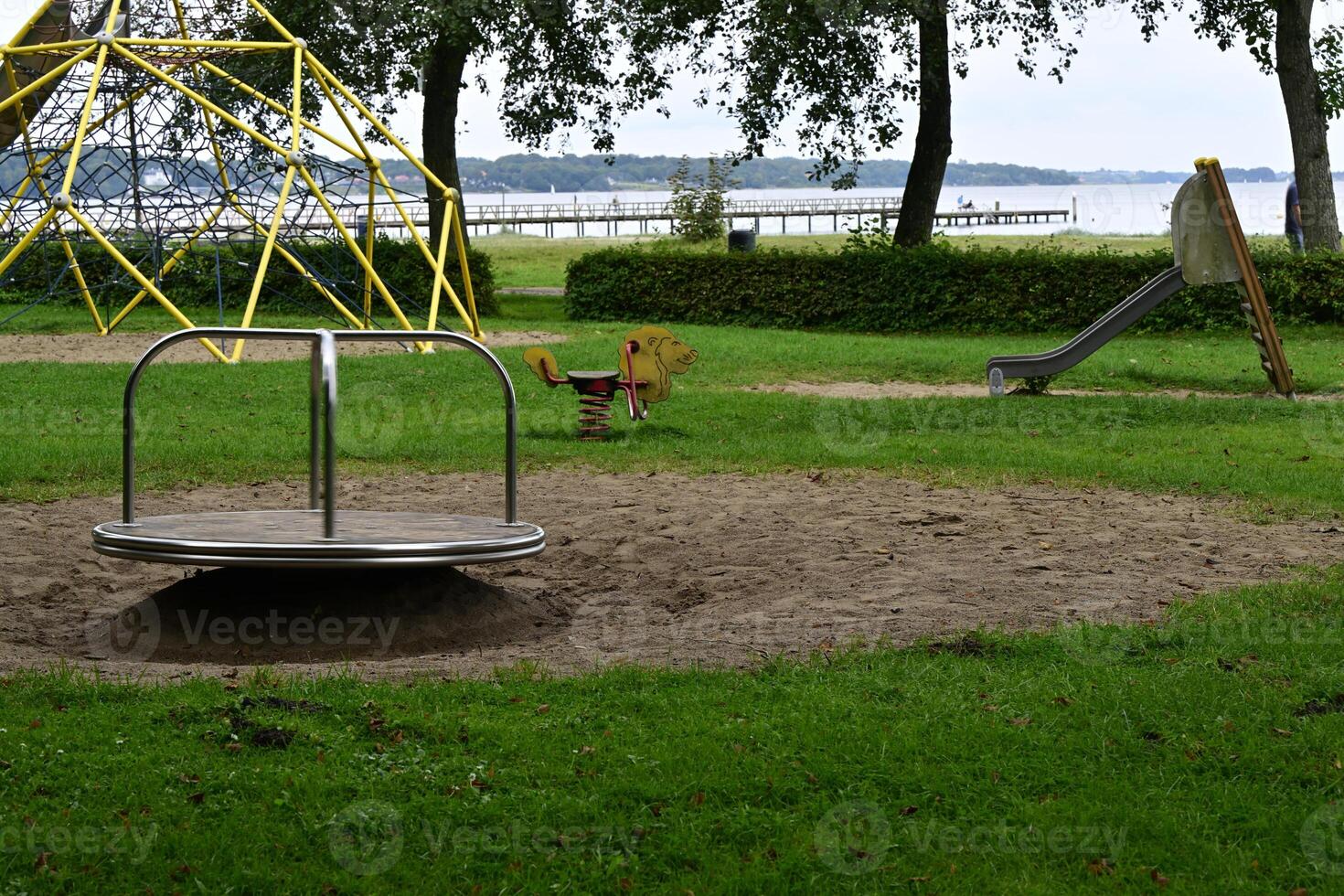 Playground with Merry-Go-Round and Slide photo