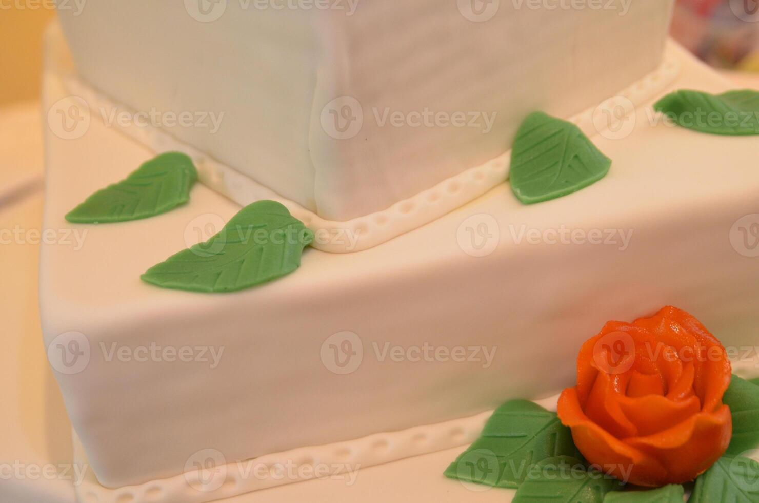 Elegant Fondant Cake with Rose and Leaves photo