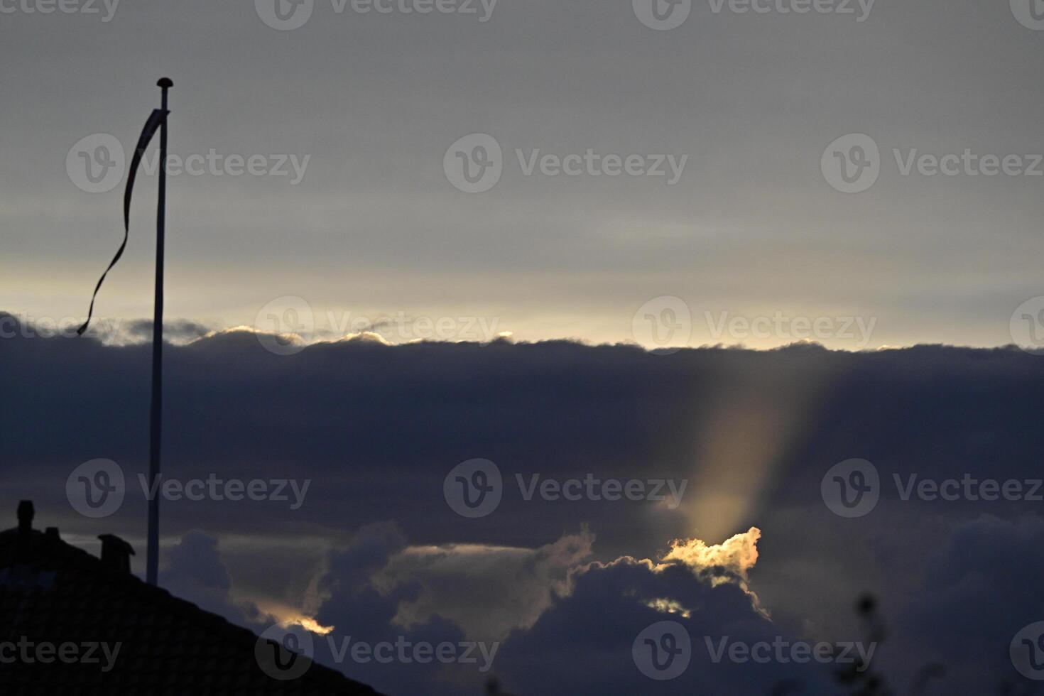 Dramatic Sunset with Rays of Light with danebrog photo