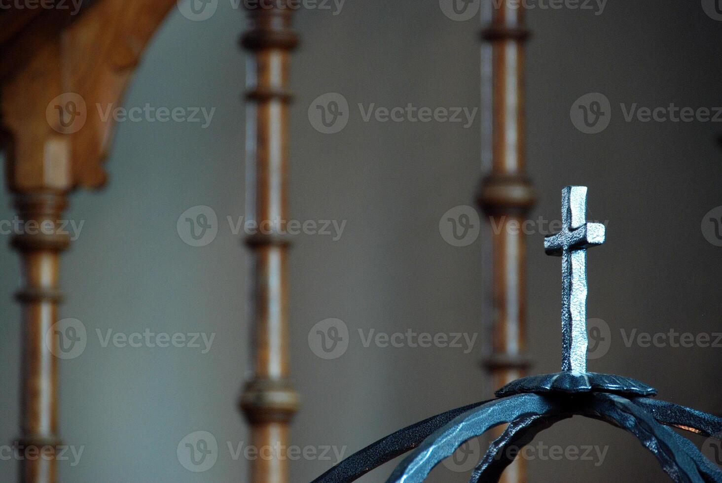 Decorative Metal Cross on Wrought Iron Structure photo