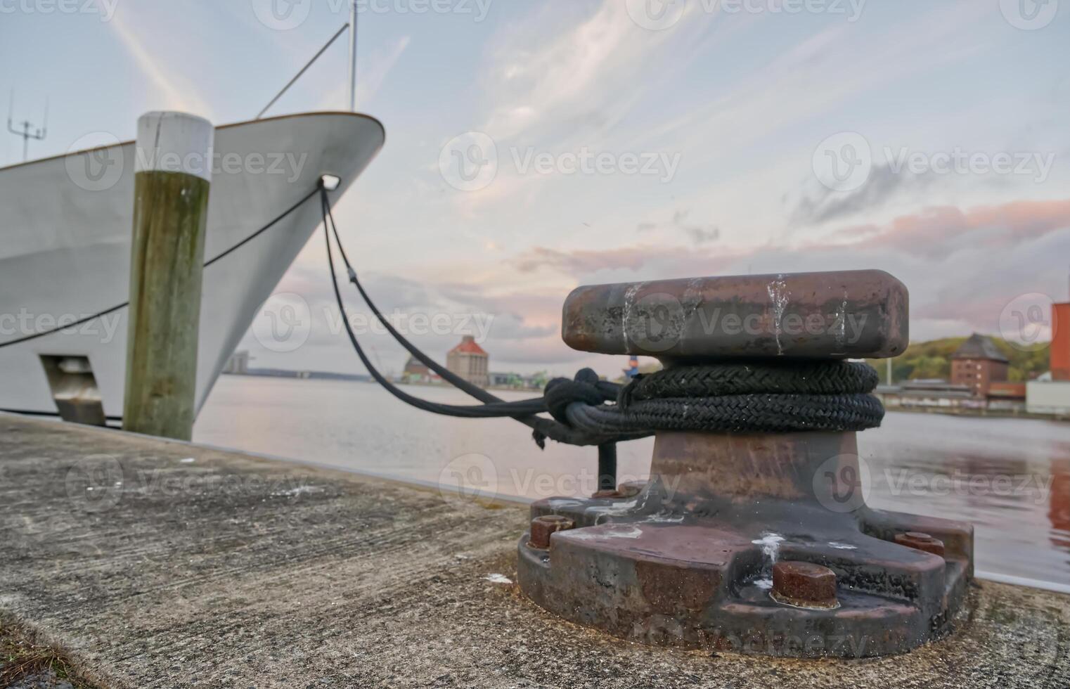 Mooring Bollard at Sunset by the Waterfront photo