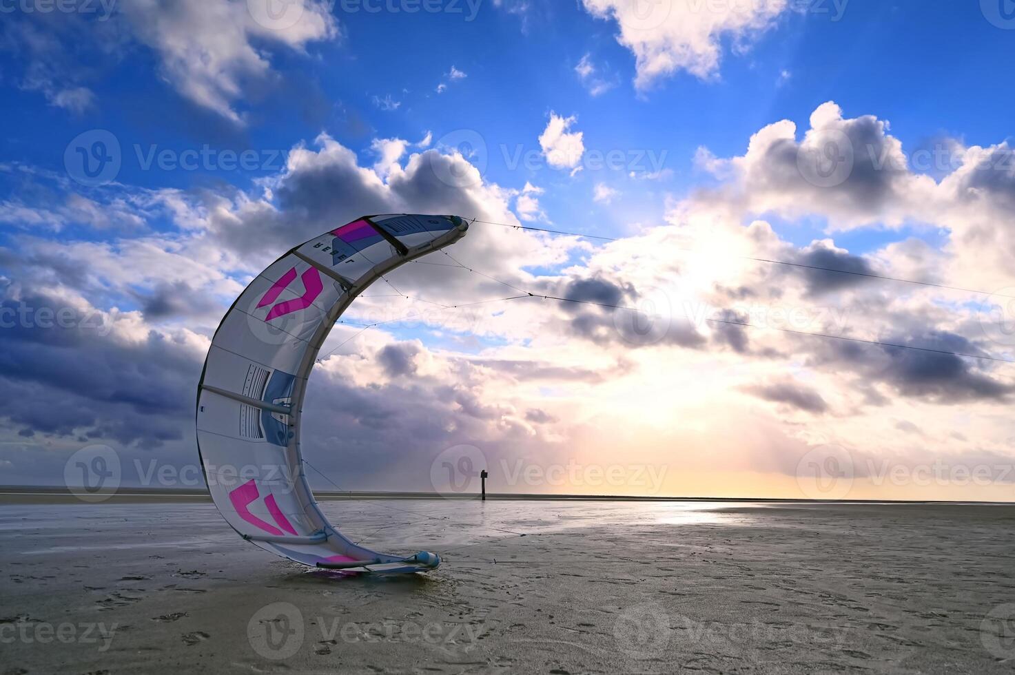 Colorful Kite at Sunset on the Beach photo