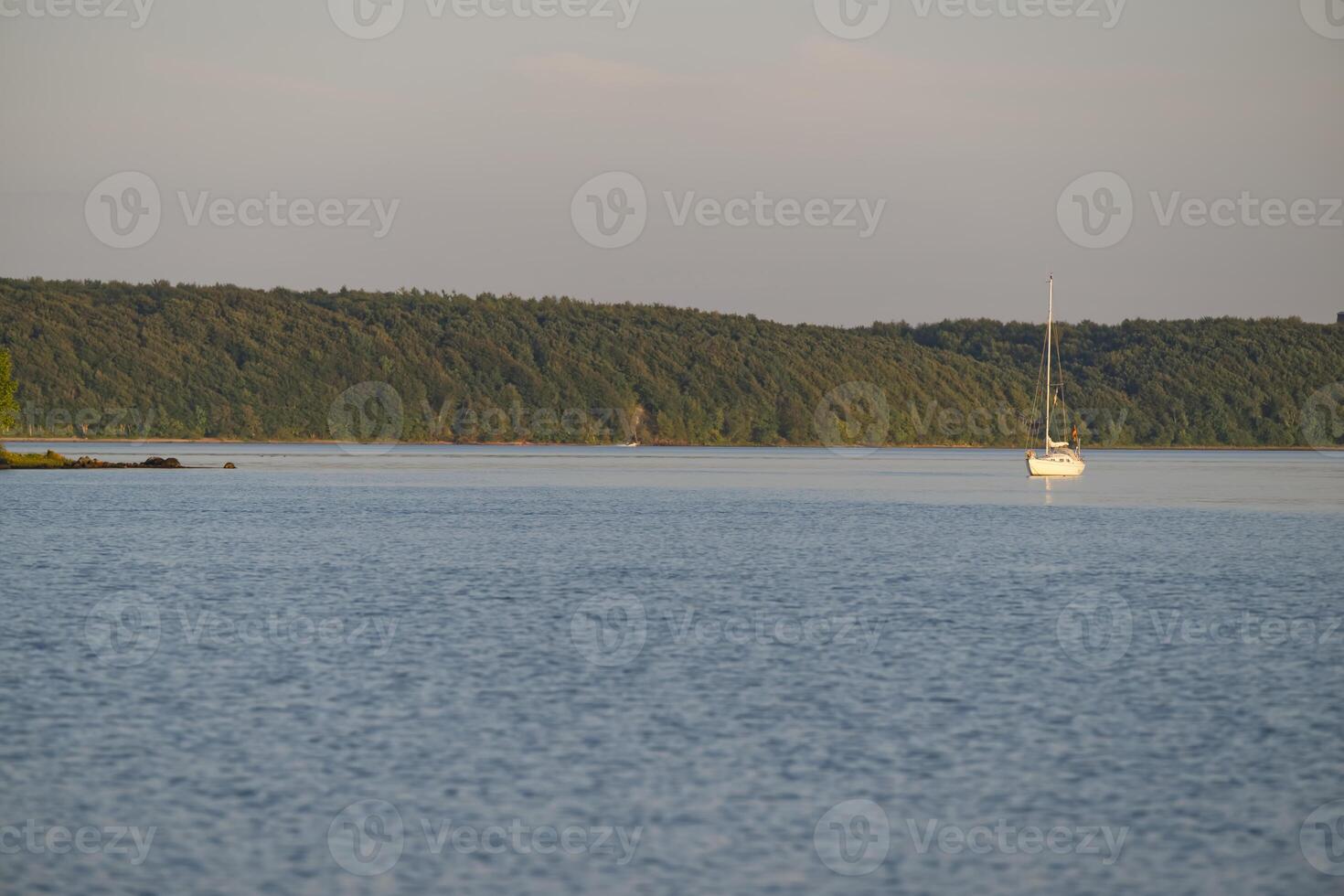 Serene Sailboat on Calm Waters photo