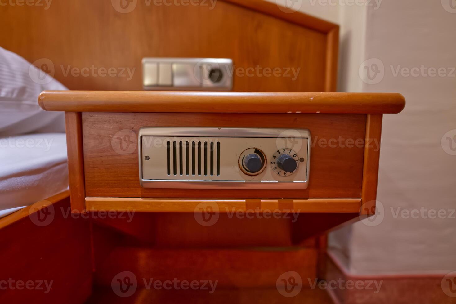 Wooden Bedside Table with Control Panel photo