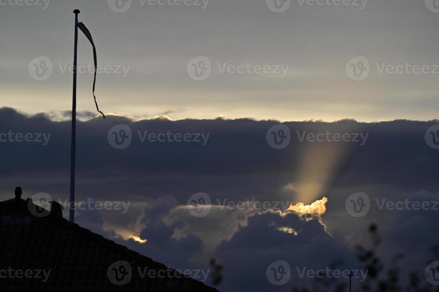 Dramatic Sunset with Rays of Light and Danebrog photo