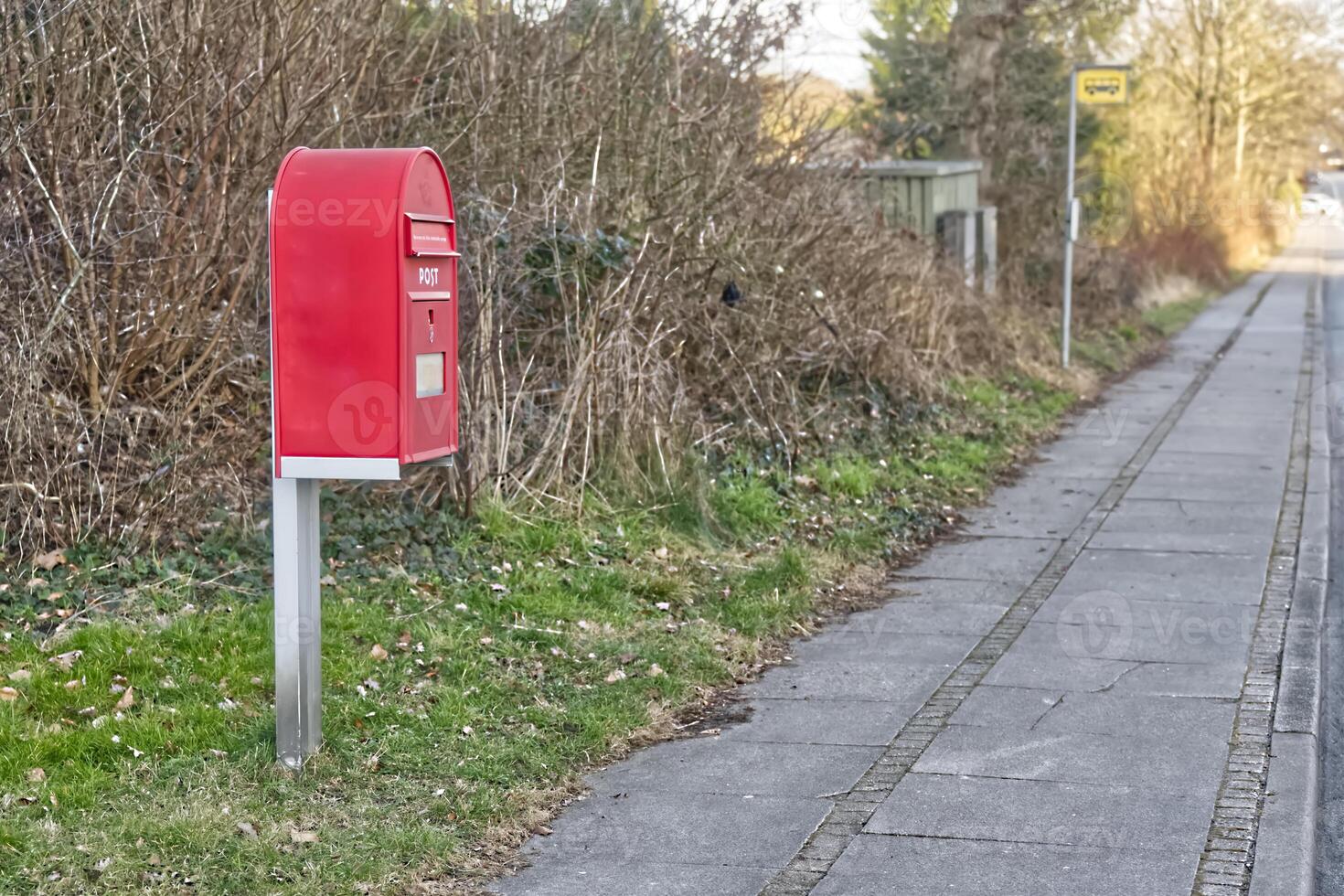 Red Mailbox by the Sidewalk in South denmark photo