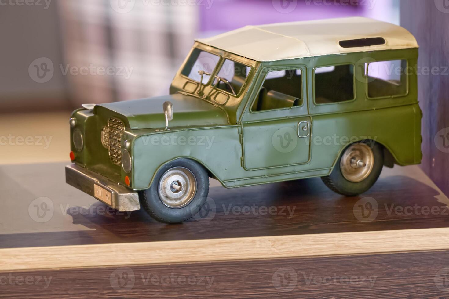 Vintage Green and Cream Toy Car Model photo