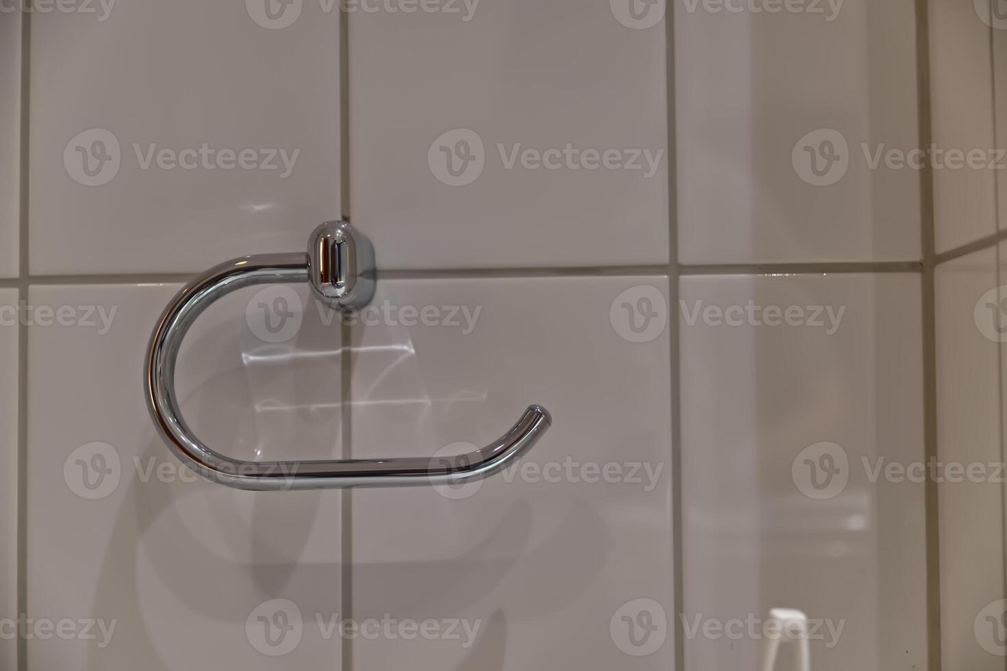 Sleek Chrome Towel Holder on Tiled Wall photo