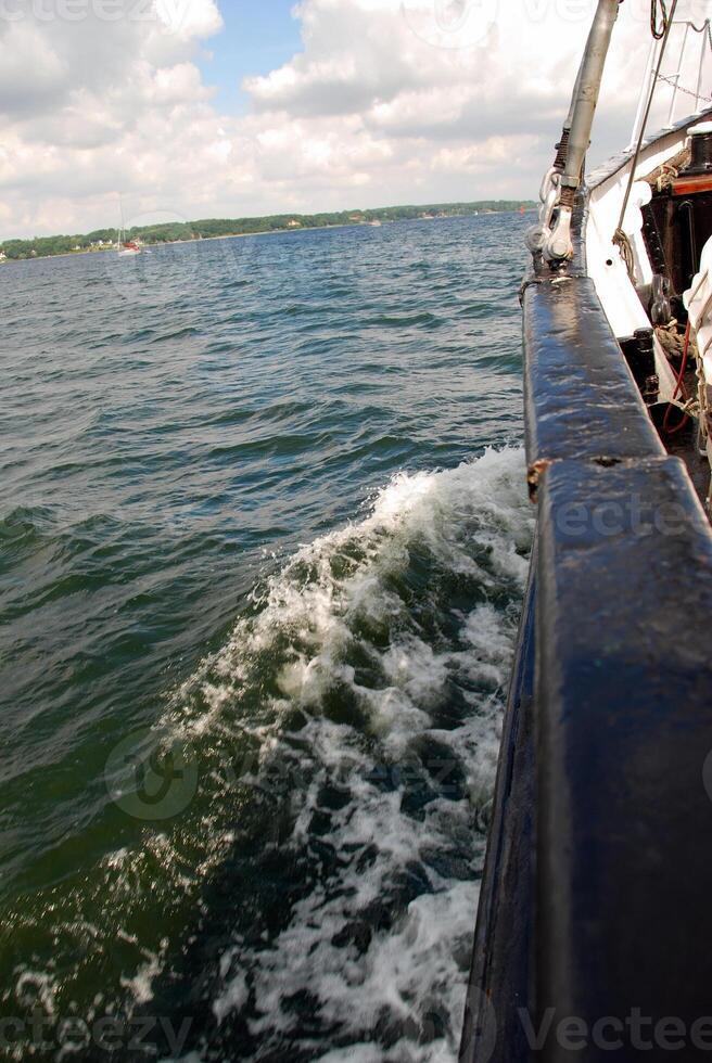 Boat View with Waves and Cloudy Sky photo