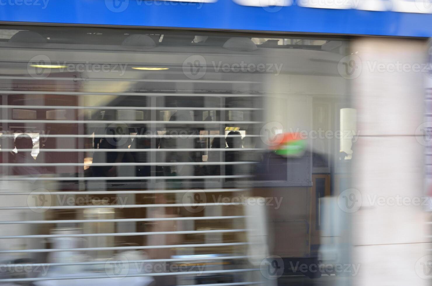 Blurred Storefront with Reflections and Shadows photo