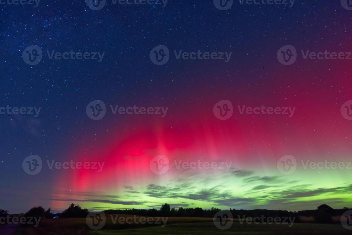 Vibrant Aurora Borealis Over Serene Landscape photo