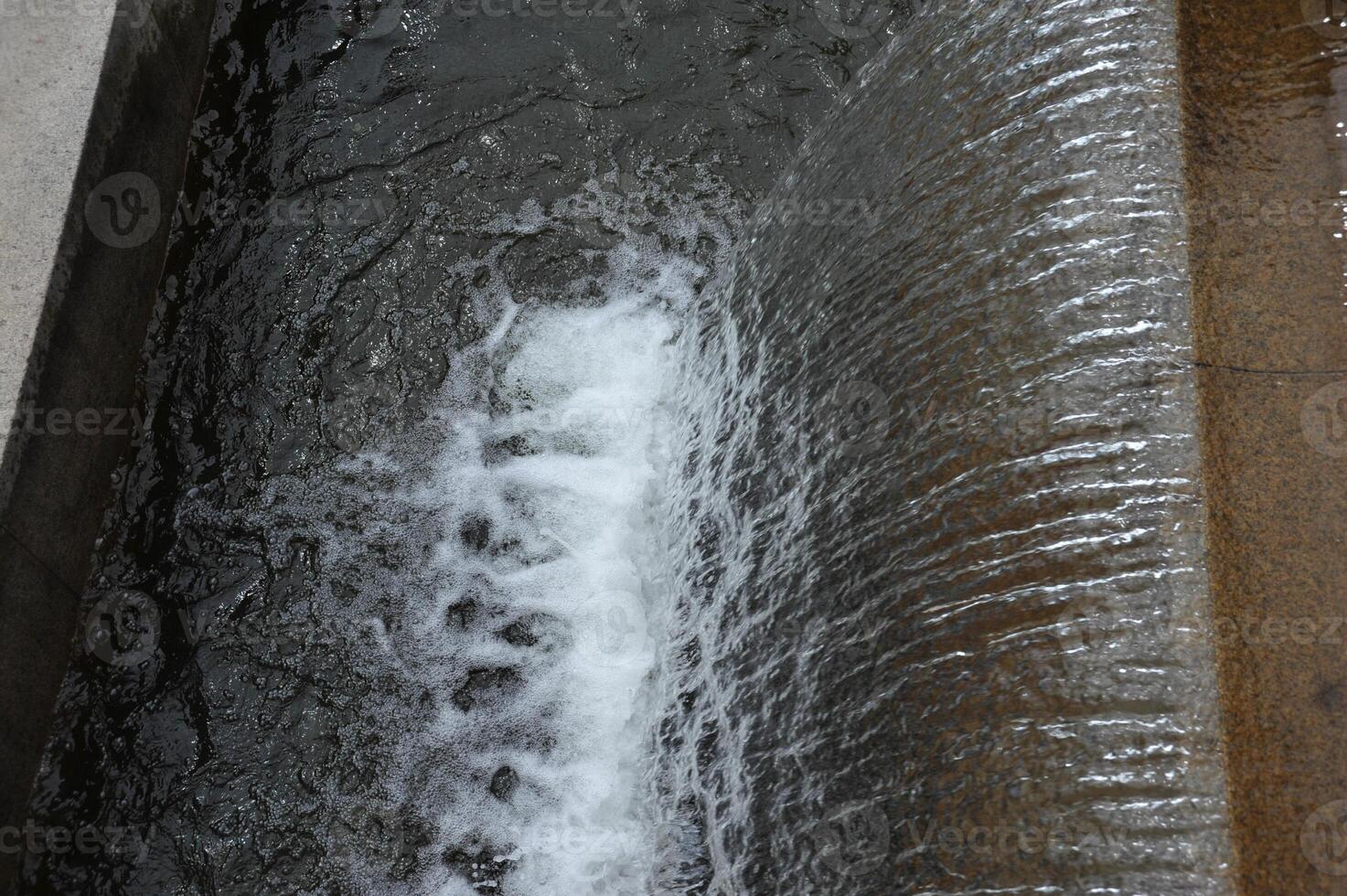 Cascading Water Over Stone Edge photo
