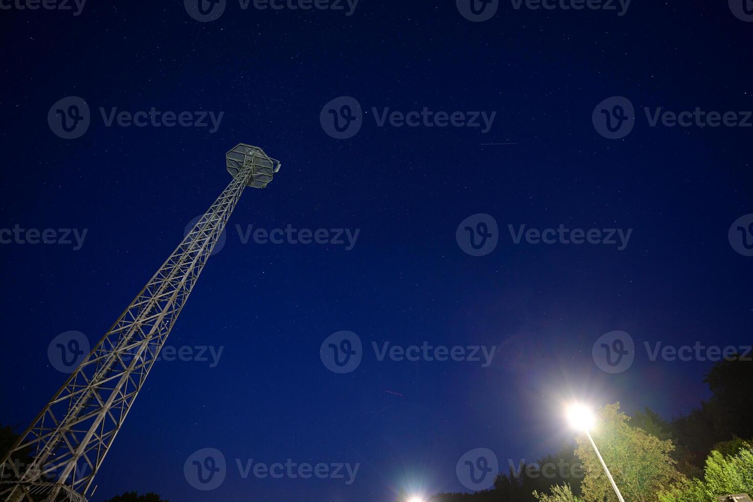 Tall Communication Tower Under Starry Night Sky photo