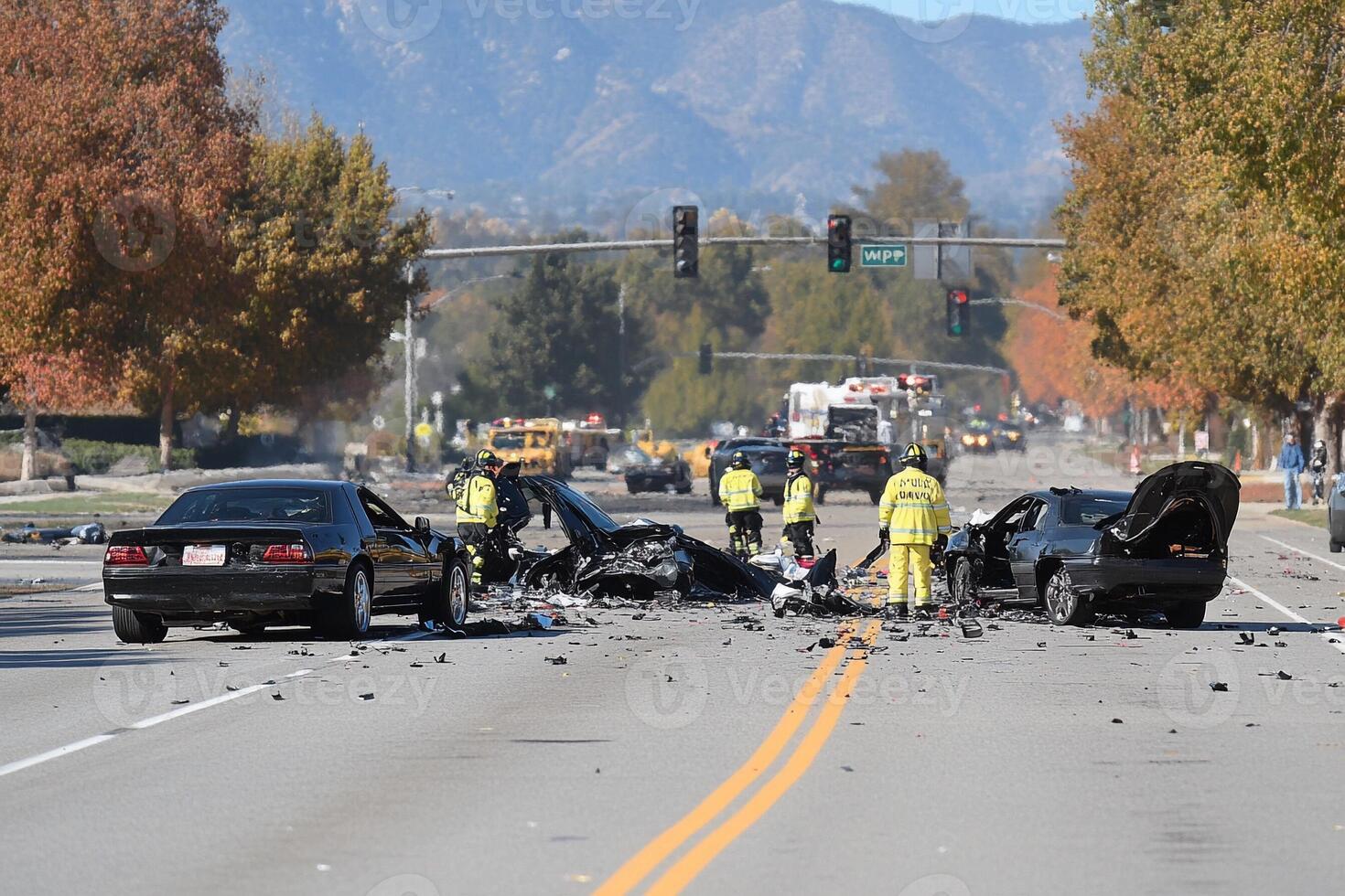 The scene of a car crash on a street photo