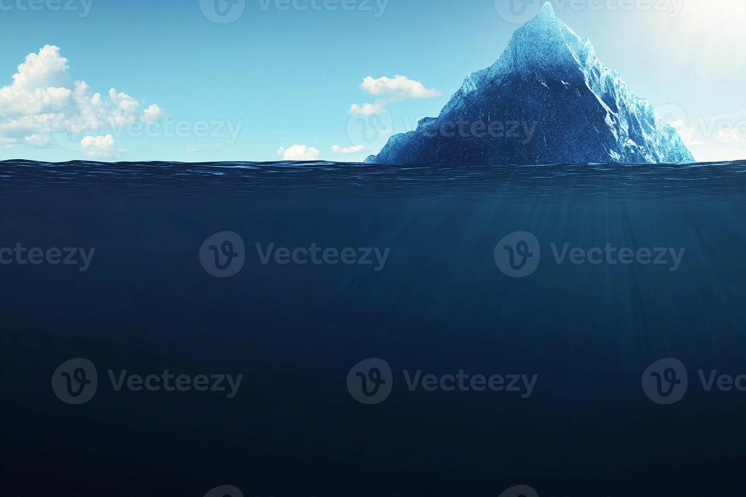An iceberg floating in the ocean with the sun shining photo