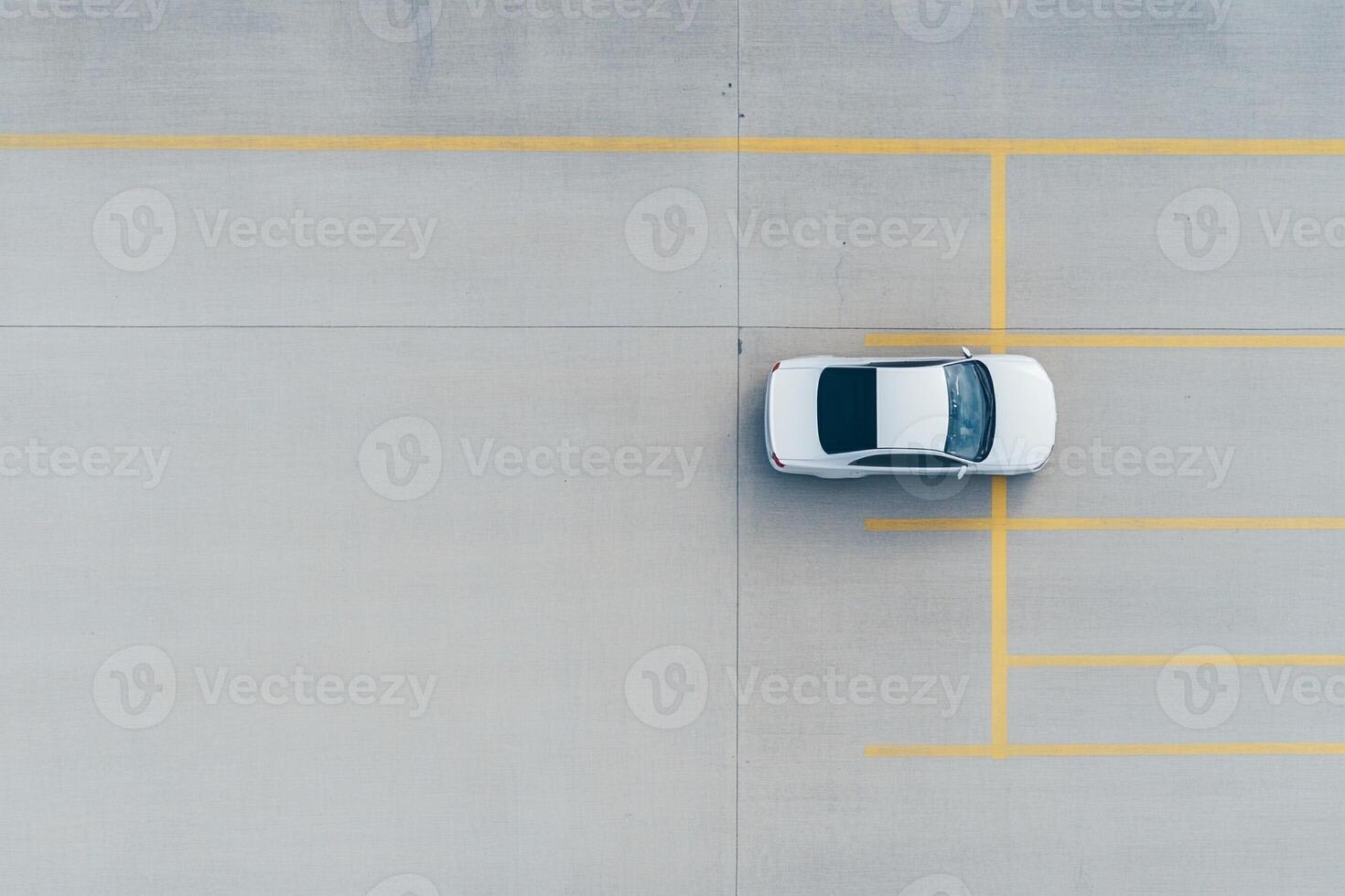 An overhead view of a car parked in a parking lot photo