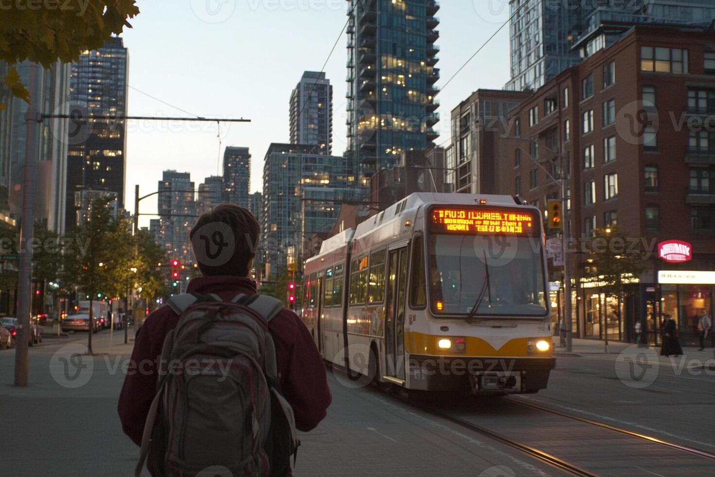 A man is walking down the street with a backpack photo