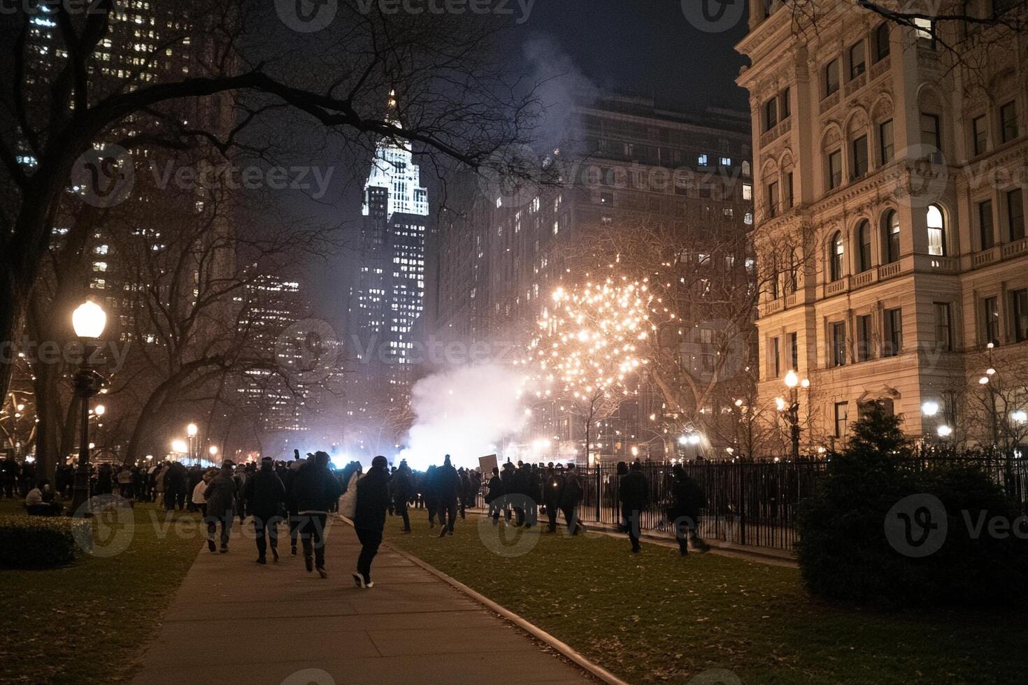 People walk down the street at night with fireworks photo