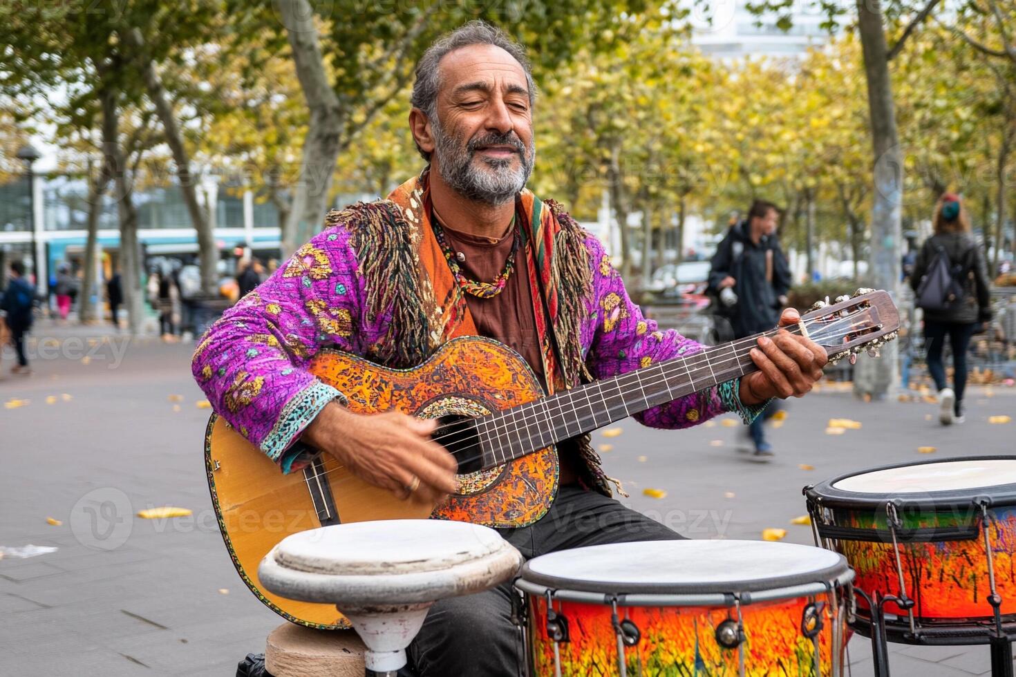 A man playing the guitar and drums in the street photo