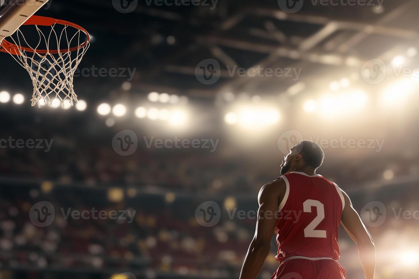 Basketball player in red jersey standing in front of the hoop photo