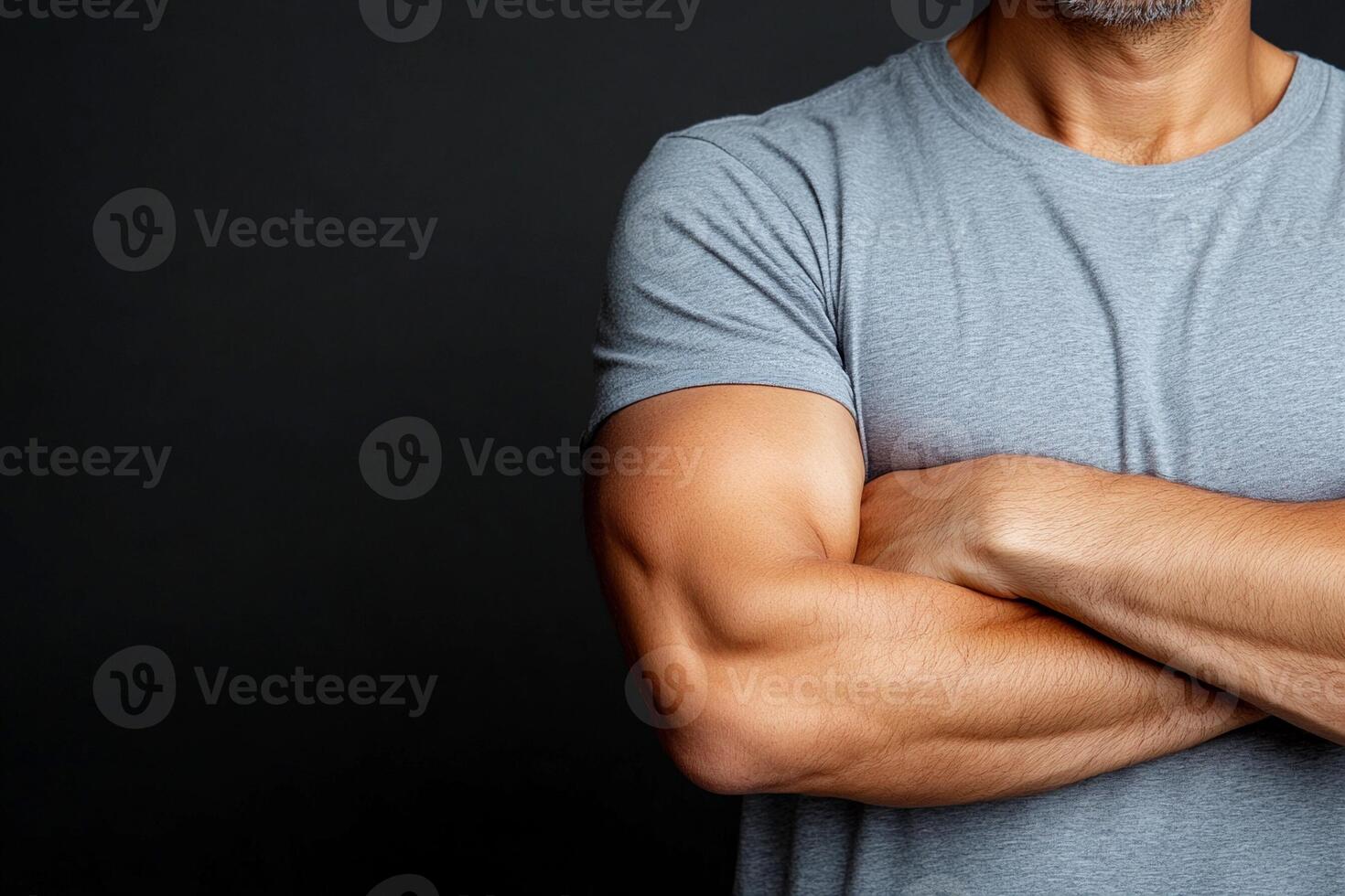 A man with arms crossed standing with his arms crossed photo