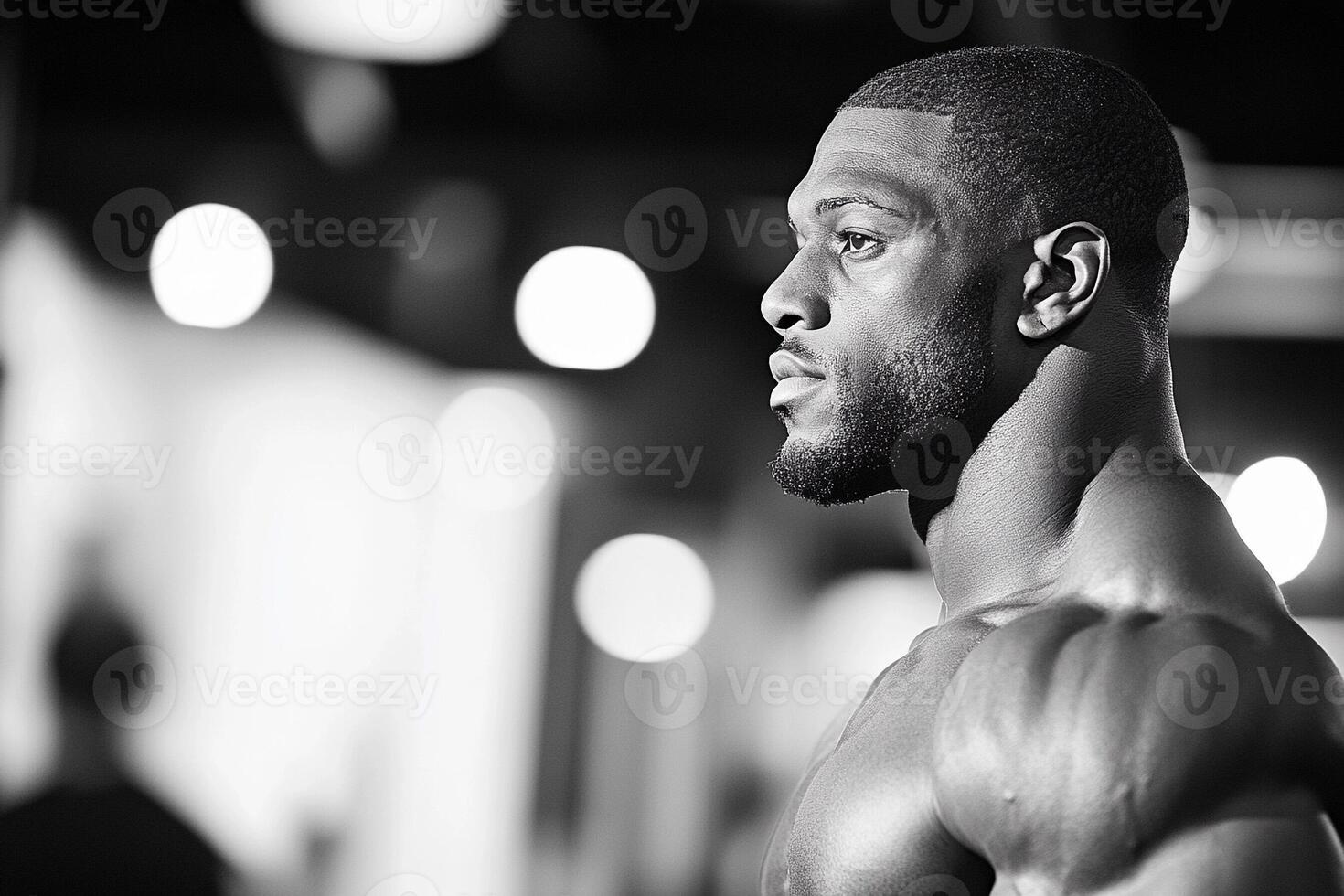 A black and white photo of a man in a gym