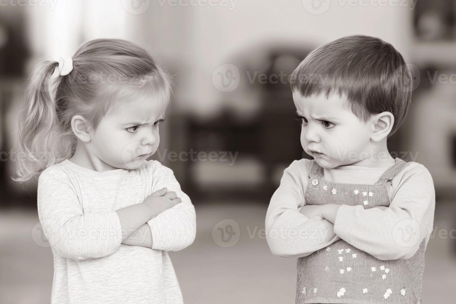 Two children are standing in front of each other photo