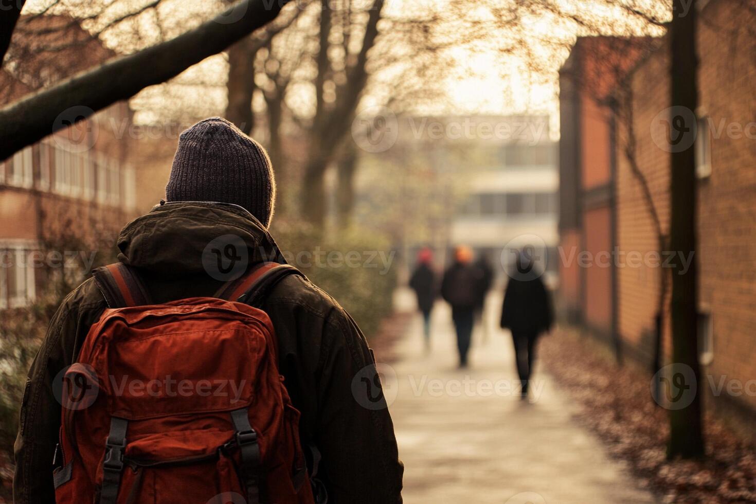 A person walking down a path with a backpack photo