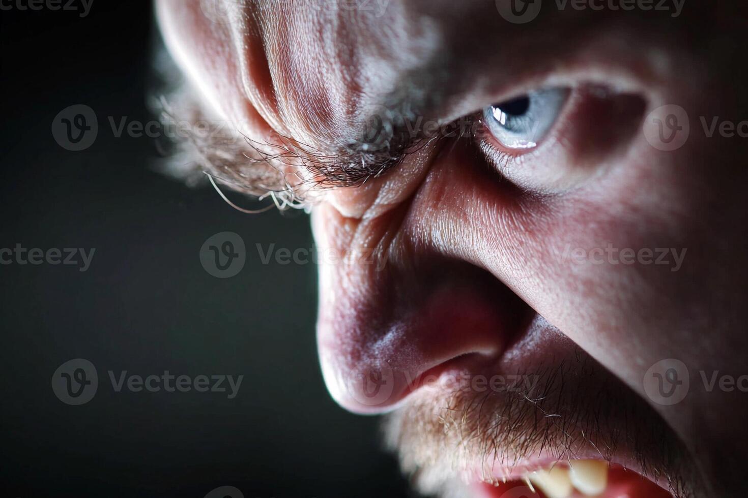 A close up of a man with his mouth open photo