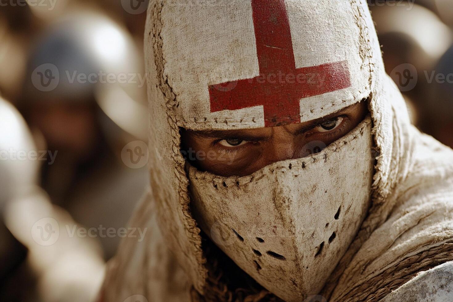 A knight in a white and red cross on his face photo