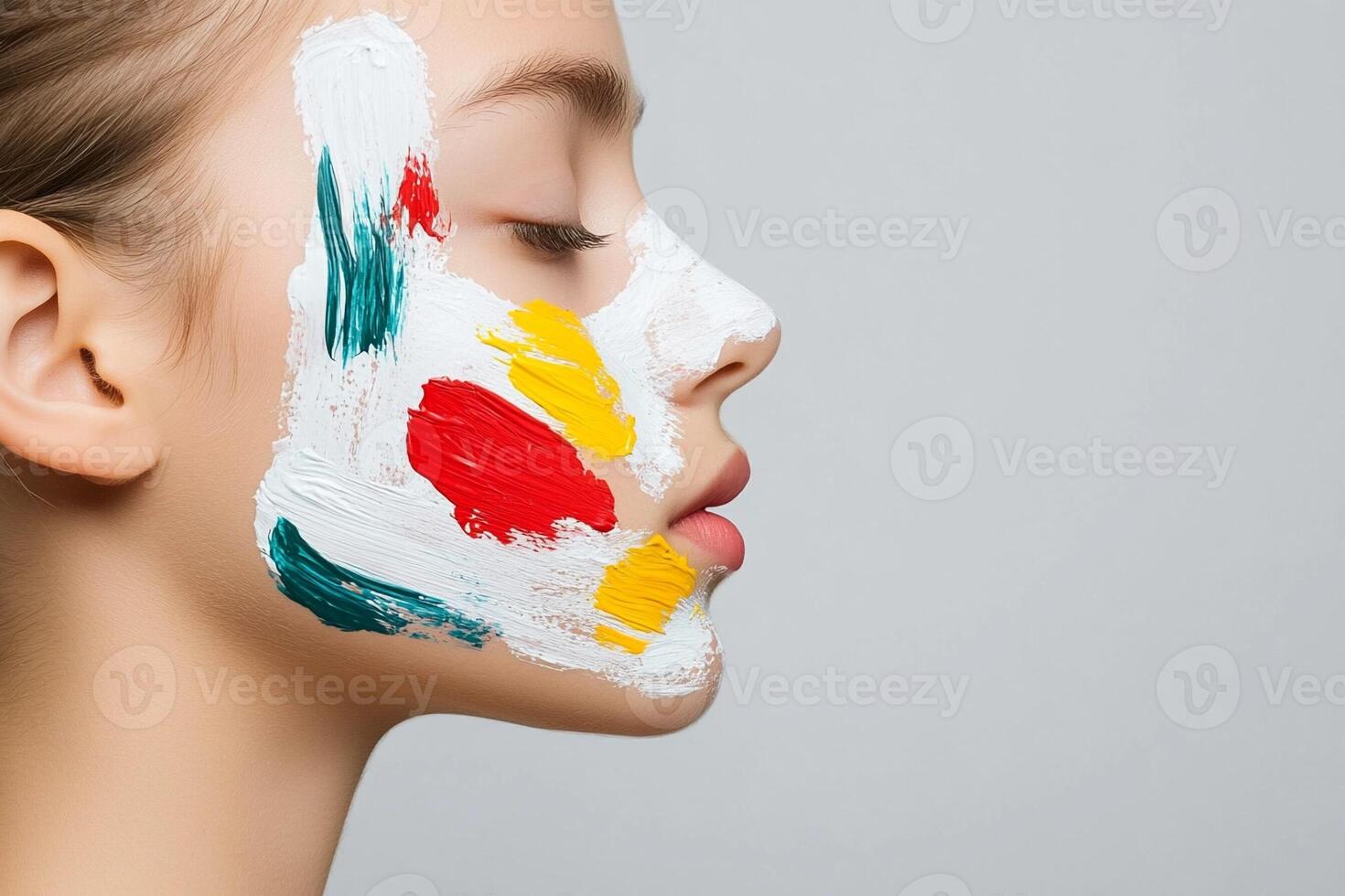 A woman with a face painted with paint photo
