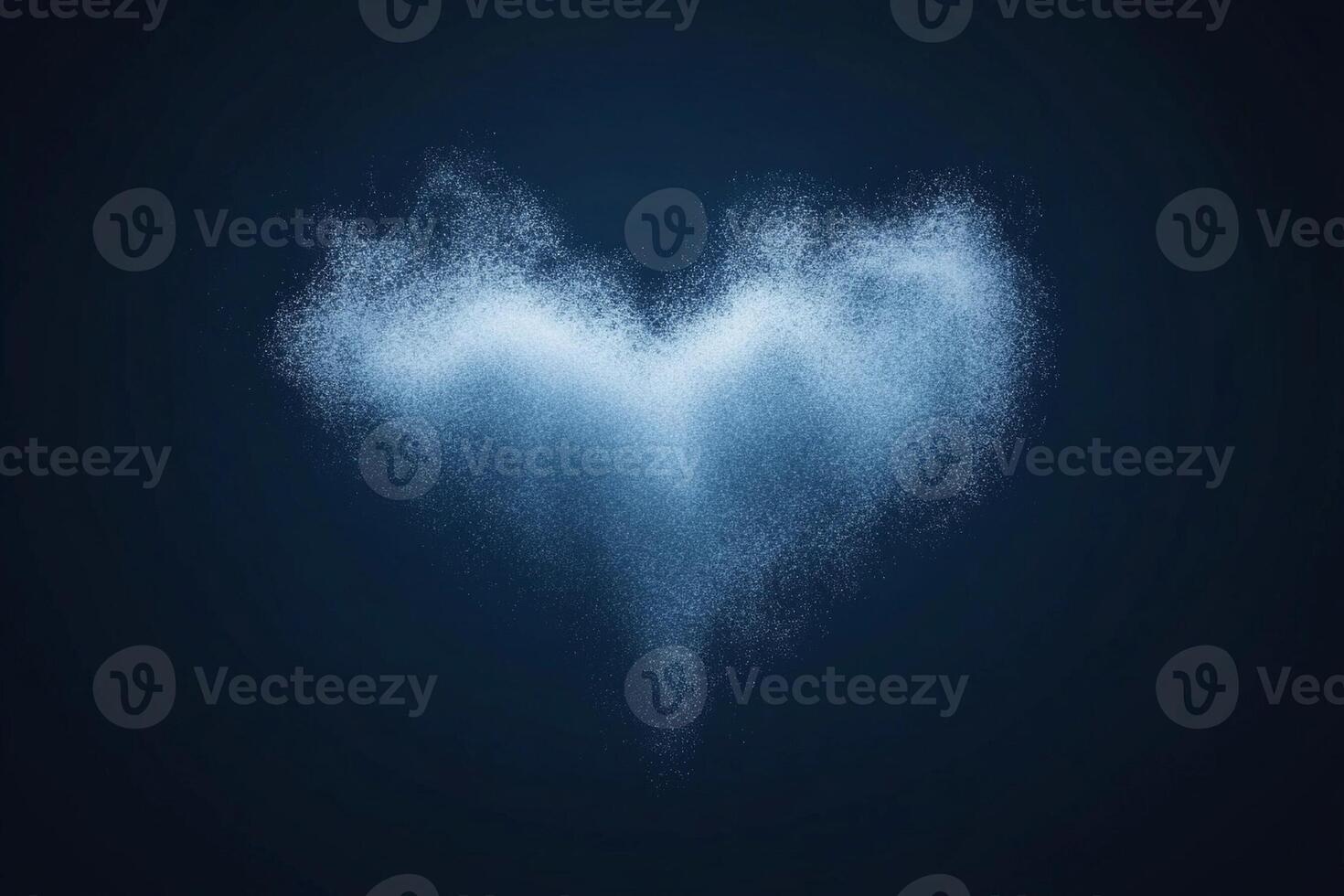 A heart shaped cloud of smoke is shown on a dark background photo