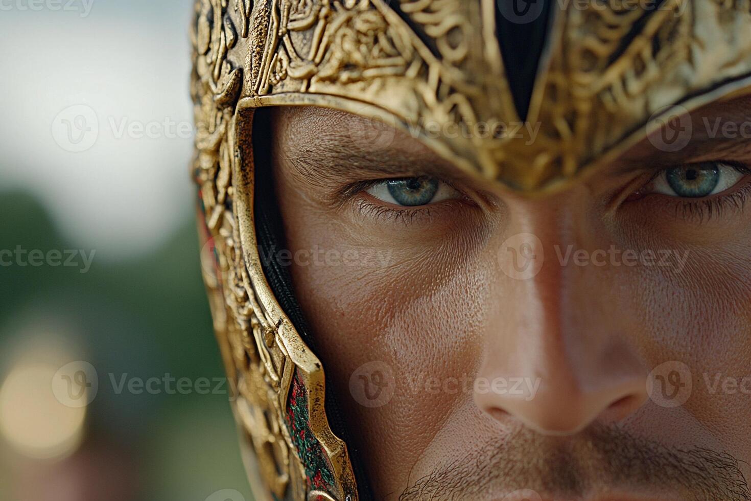 A close up of a man wearing a golden helmet photo