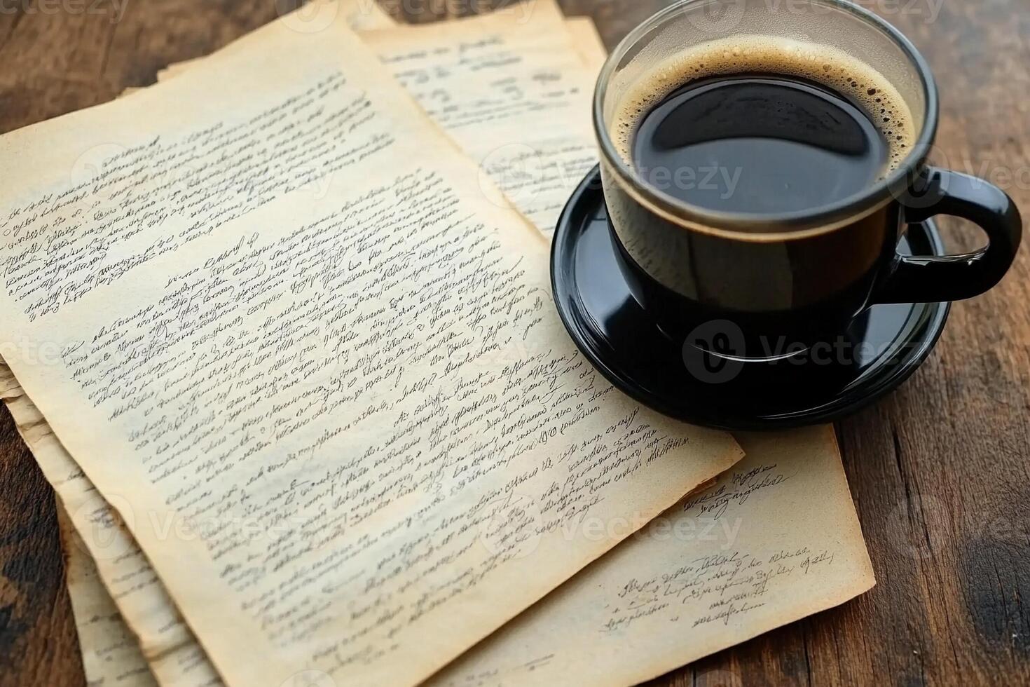 A cup of coffee and old documents on a wooden table photo