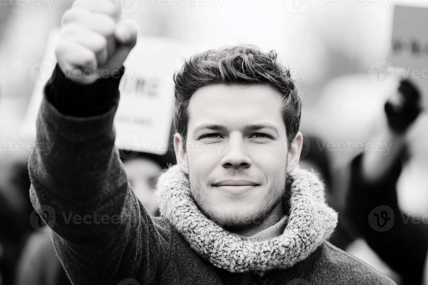 A man is holding up his thumb in a protest photo