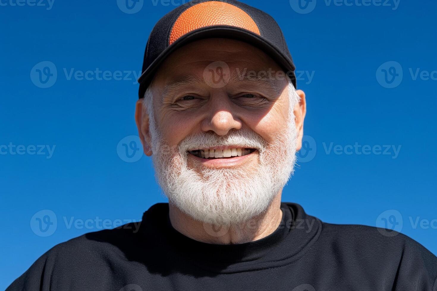 A man with a beard and a baseball cap photo