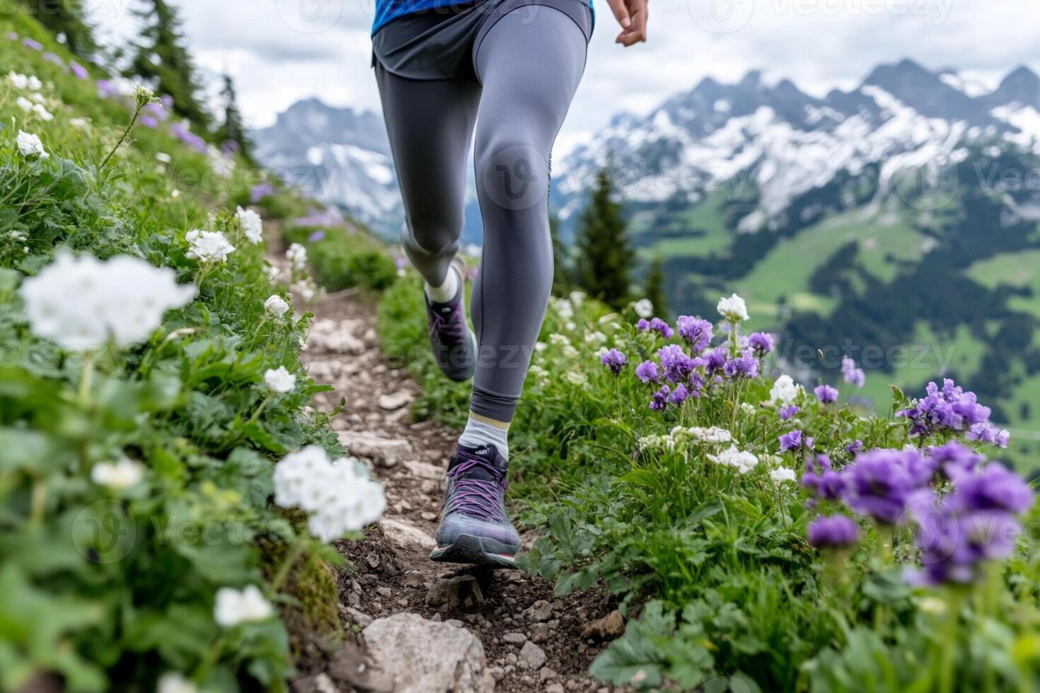 A person running on a trail with flowers in the background photo
