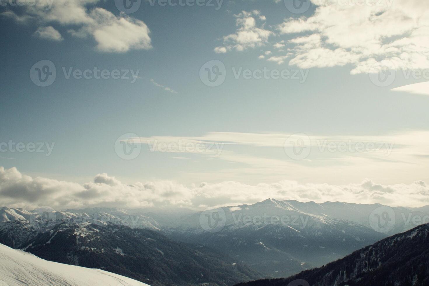 A person is skiing down a mountain photo