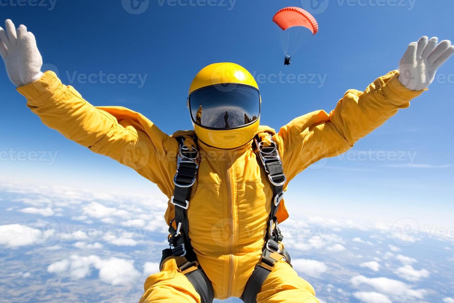 A person in yellow jumpsuit with arms outstretched photo