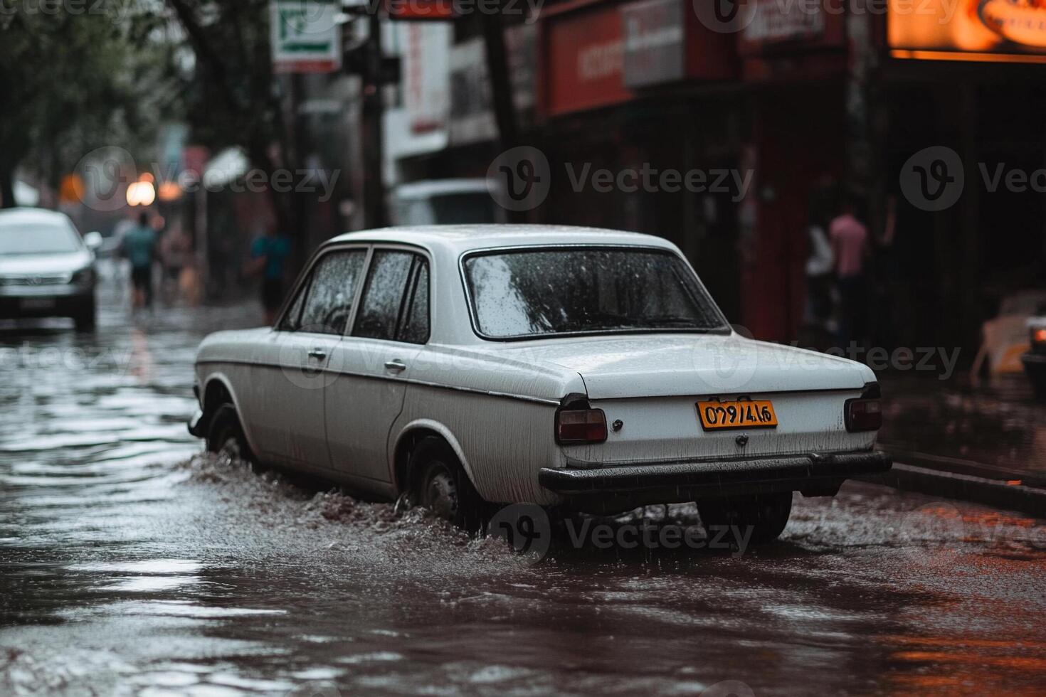 A car driving through a flooded street photo