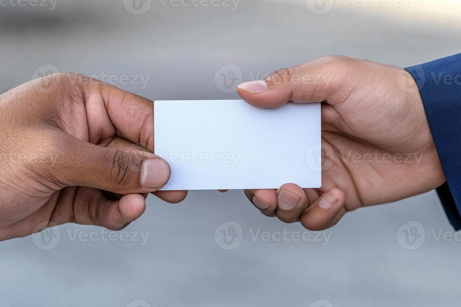 Two hands holding a blank business card photo