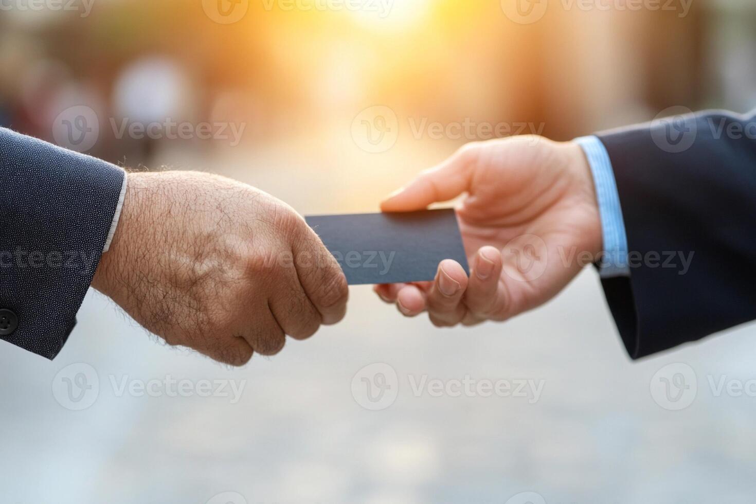 Businessman shaking hands with another man photo