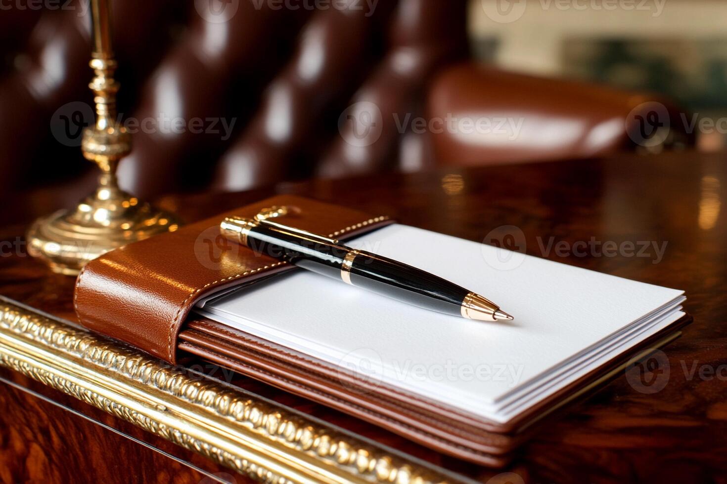 Notebook and pen on a desk in a hotel room photo