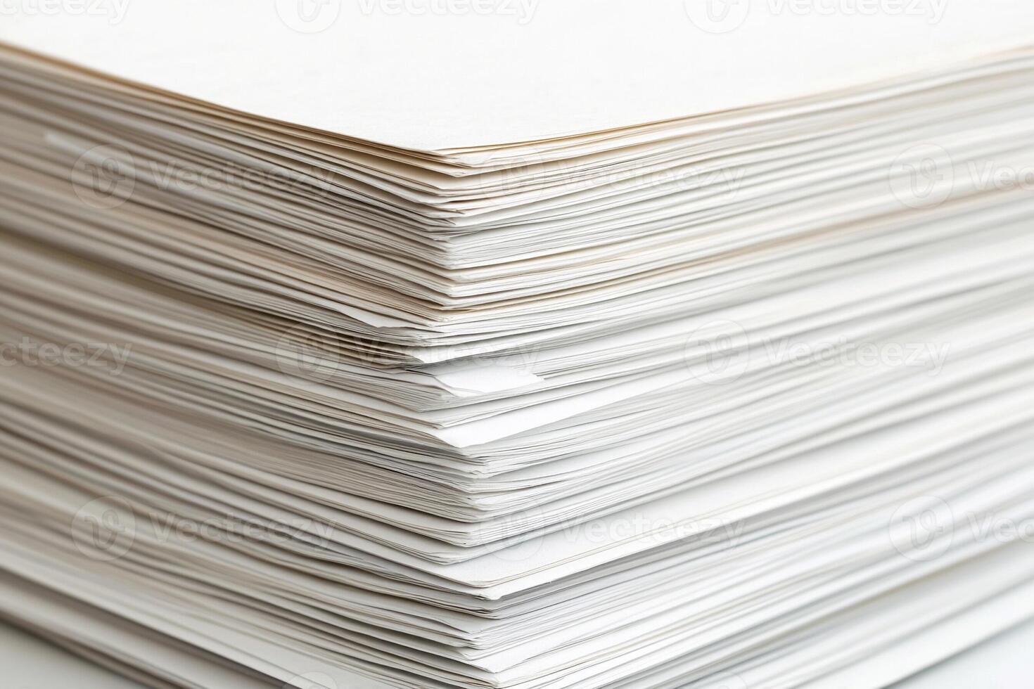 A stack of white paper on a table photo
