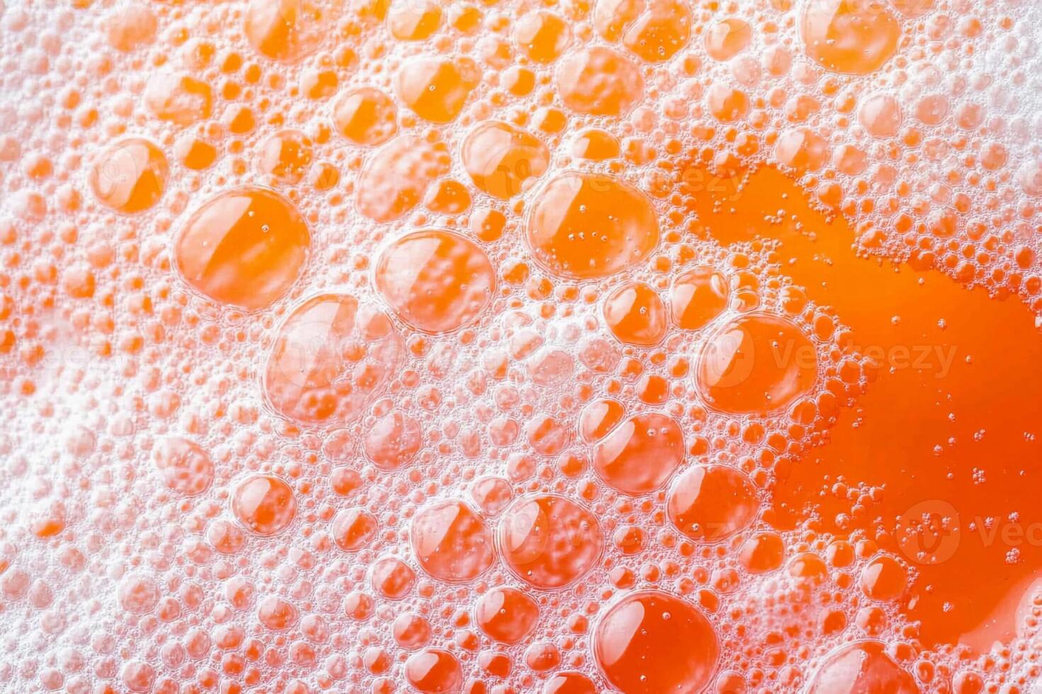 Orange bubbles in a bath of soap photo