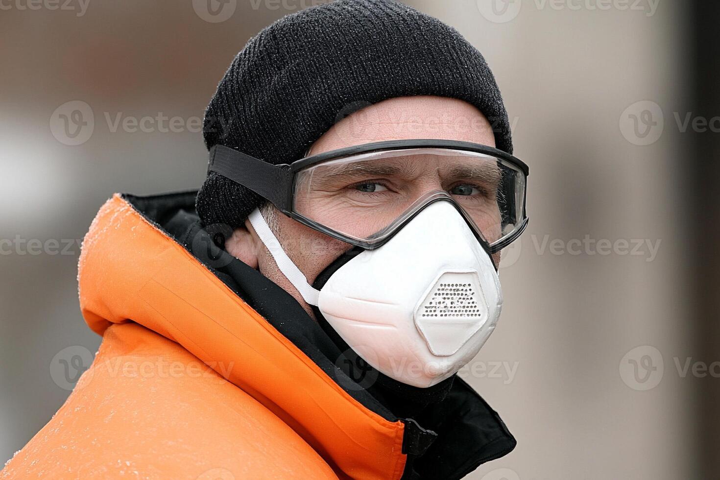 A man wearing a face mask and goggles photo