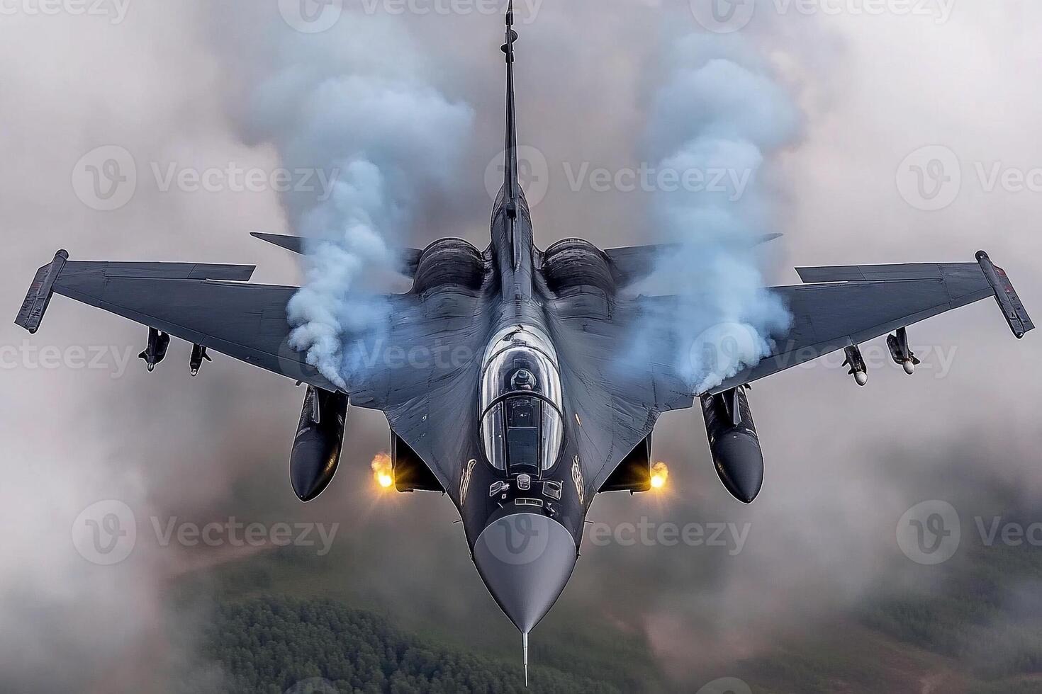 A fighter jet flying through the air with smoke coming out of its tail photo