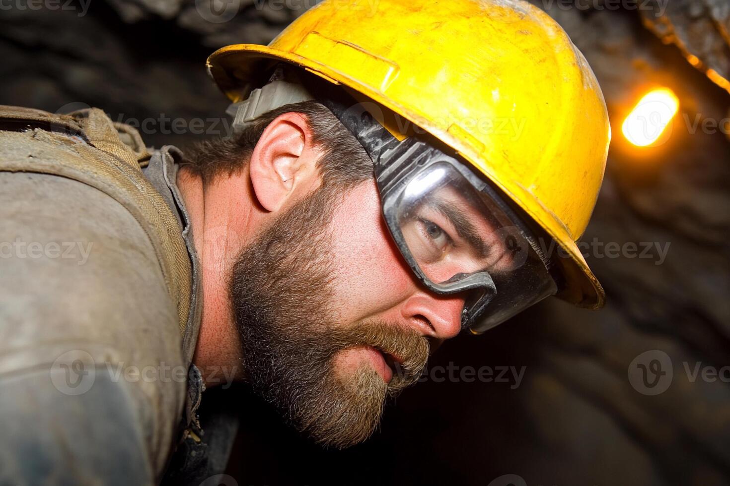 A man with a beard and glasses in a mine photo