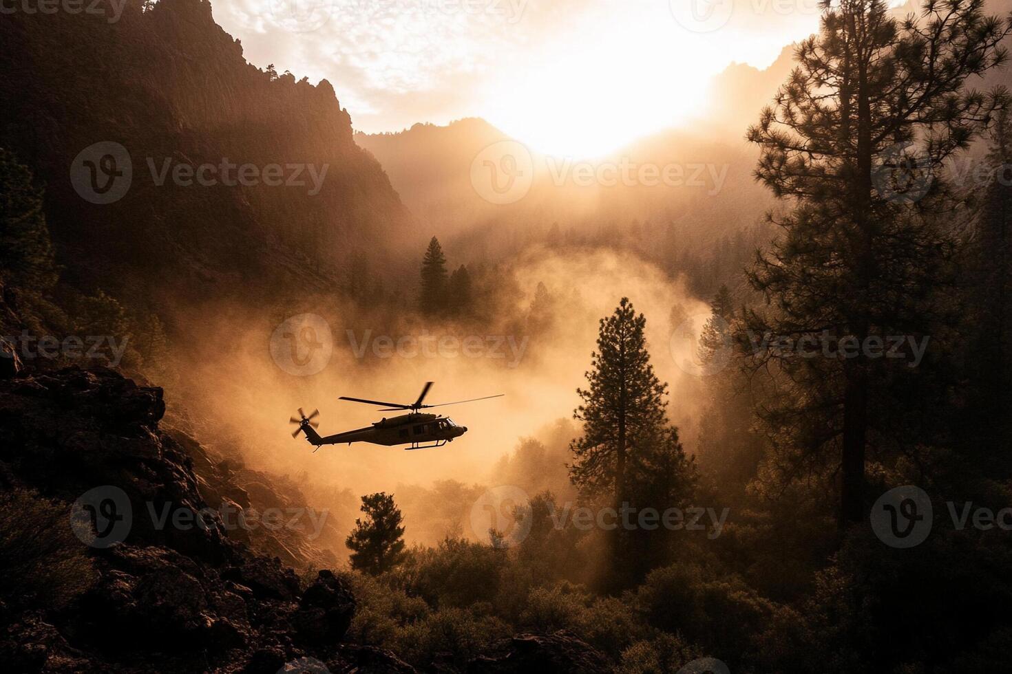 A helicopter flying over a mountain with fog and trees photo